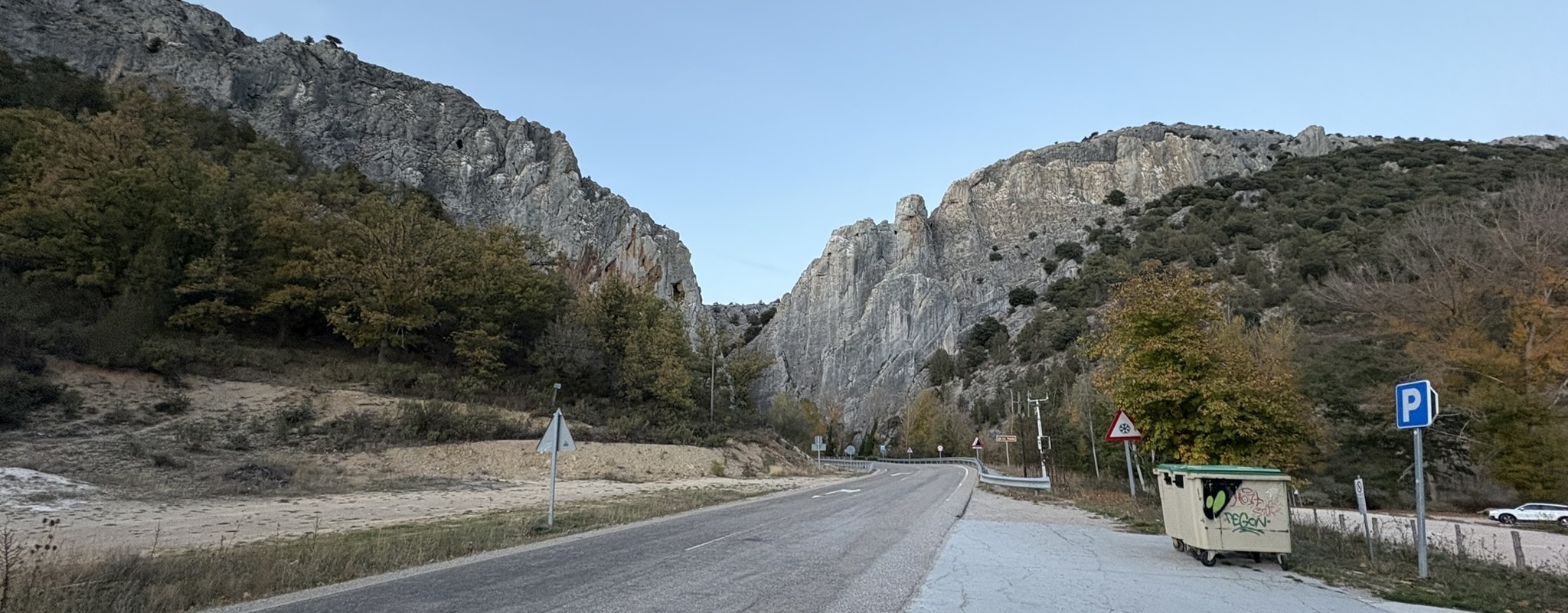 La Yecla, a dramatic massive rock formation resembling a giant wall. The imposing cliff face rises steeply against the sky in the Sierra de la Demanda.