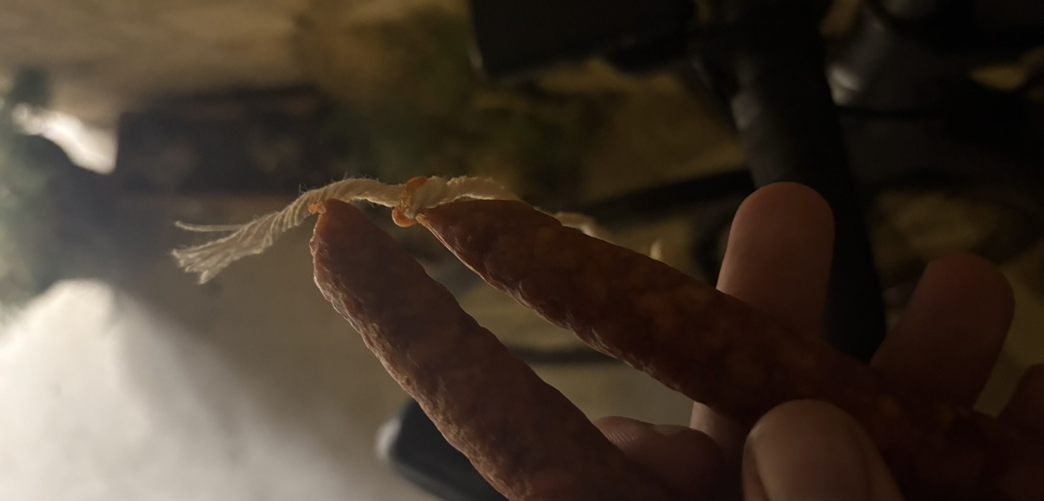 A thin buttery chorizo-like sausage on its packaging, bought from a small grocery store as an evening snack.